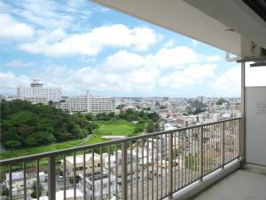 a view of the city from a balcony at Cozy Stay in Naha in Naha