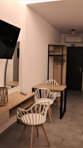 TV a/nebo společenská místnost v ubytování Nautico Rooms