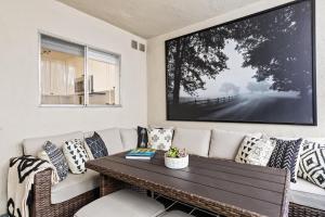 a living room with a couch and a table at Double King Suite with Patio Dining and Parking NRP21-00386 in Long Beach