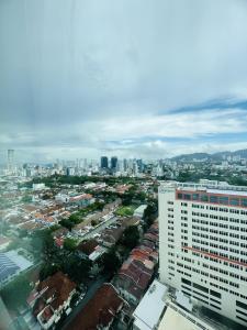 a city view of a city with a tall building at Mansion One by PerfectSweetHome in George Town