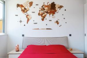 a bedroom with a world map wall mural at [Free parking-Golf-Garden] in Losone