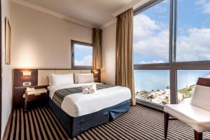 Postel nebo postele na pokoji v ubytování Golan Hotel + 37 fotografií