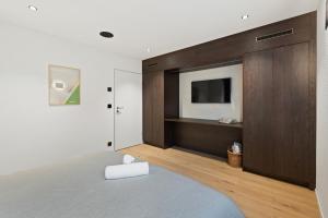 Postel nebo postele na pokoji v ubytování The R Apartment Uetliberg Parken - Wallbox