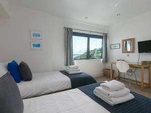 En eller flere senge i et værelse på Stargazy