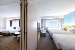 Ein Bett oder Betten in einem Zimmer der Unterkunft Holiday Inn Osaka Namba by IHG