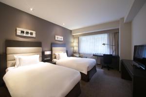 Ein Bett oder Betten in einem Zimmer der Unterkunft Holiday Inn Osaka Namba by IHG