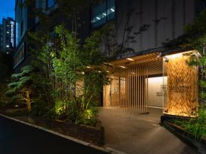 a courtyard in a building at night with lights at MIMARU Tokyo IKEBUKURO in Tokyo