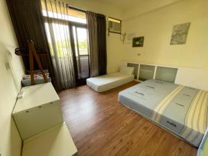 Letto o letti in una camera di HeMei Homestay