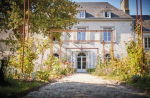 a house with a pathway leading to the front door at la_grande_guerais in Beaussais sur Mer