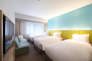 Ein Bett oder Betten in einem Zimmer der Unterkunft Holiday Inn Osaka Namba by IHG