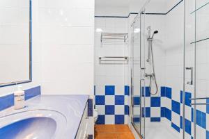 a bathroom with a sink and a shower at MEDANO4YOU Jaquita Paradise Holiday Home in El Médano +35 photos