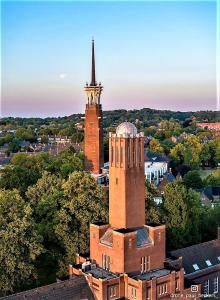 a brick building with a tower on top of it at Back-Stage in Nijmegen