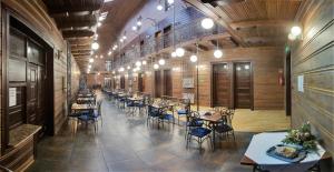 a large room with tables and chairs in a building at Maria in Rymanów-Zdrój