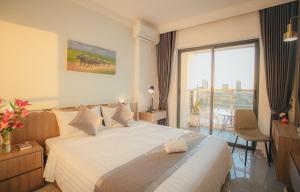 Postel nebo postele na pokoji v ubytování M9 Kirirom Hotel