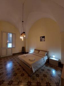 A bed or beds in a room at Casa Paola