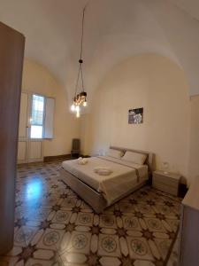 a bedroom with a large bed in a room at Casa Paola in Cutrofiano