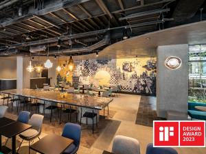 a dining room with a large table and chairs at Prince Smart Inn Kyoto Sanjo in Kyoto