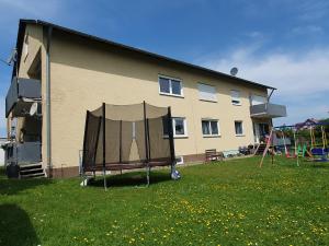 a house with a tent in front of it at ruhige und moderne 2-Zi. Wohnung in Külsheim
