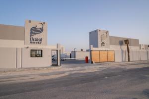 a building with a door to a garage at منتجع دلال الفندقي Dalal Hotel Resort in Dammam