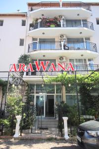 an apartment building with a sign that readsarmaarma at Къща за гости "Arawana" in Sunny Beach