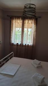 A bed or beds in a room at Xristina's Experience
