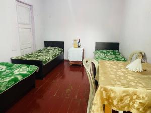 Postel nebo postele na pokoji v ubytování Guesthouse ''Loni''