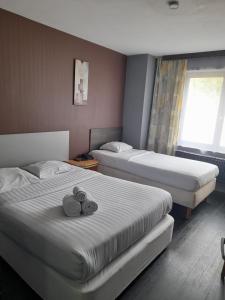 Ein Bett oder Betten in einem Zimmer der Unterkunft Hotel Albergo
