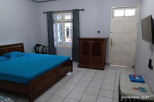 Postel nebo postele na pokoji v ubytování Hotel Merak Indah