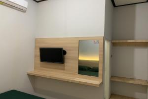 TV a/nebo společenská místnost v ubytování Hotel Merak Indah
