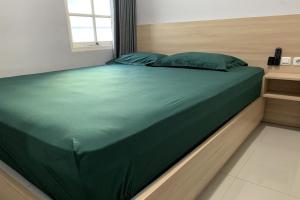 Postel nebo postele na pokoji v ubytování Hotel Merak Indah