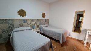 Postel nebo postele na pokoji v ubytování Hostal Canalejas