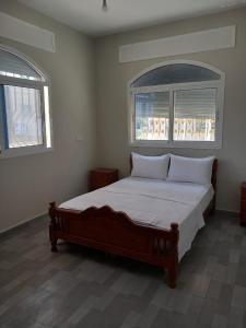 מיטה או מיטות בחדר ב-Flat cosy La CAMELIA Inn Tanger
