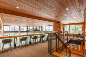 a room with a bar with stools and windows at First Hill jr 1br w gym lounge bbq nr park SEA-580 in Seattle