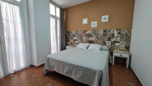 Postel nebo postele na pokoji v ubytování Hostal Canalejas