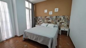Postel nebo postele na pokoji v ubytování Hostal Canalejas