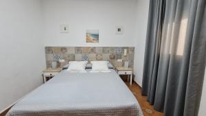 Postel nebo postele na pokoji v ubytování Hostal Canalejas