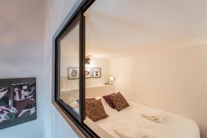 Postel nebo postele na pokoji v ubytování Loft Cosy et atypique