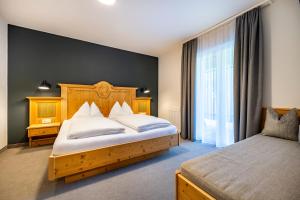 Postel nebo postele na pokoji v ubytování Aparthotel Jägerheim