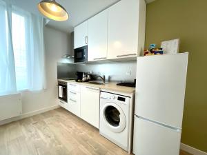 A cozinha ou cozinha compacta de Maison Boucicaut - 5 logements - BY PRIMO C0NCIERGERIE