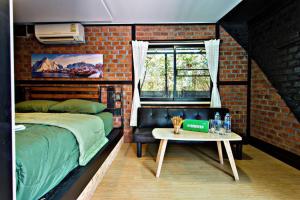 Postel nebo postele na pokoji v ubytování 99/9 Box Resort