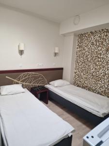 Postel nebo postele na pokoji v ubytování Ecoland Hotel