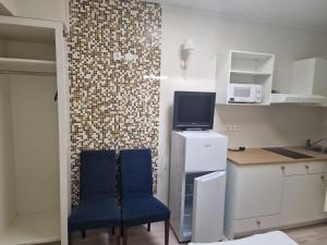 Kuchyň nebo kuchyňský kout v ubytování Ecoland Hotel