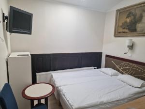 Postel nebo postele na pokoji v ubytování Ecoland Hotel
