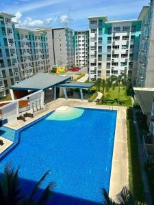 a large blue swimming pool in front of some buildings at Seawind Condominiums Tower 1,3,4,5 in Davao City