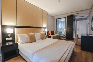 Postel nebo postele na pokoji v ubytování Hotel Oasis + 37 fotografií