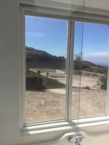 a window in a bathroom with a view of the ocean at Studio III at orig. Finca,, sea views in La Asomada