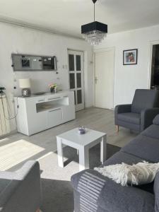 a living room with a couch and a table at Dolce vita Apartment in Senj