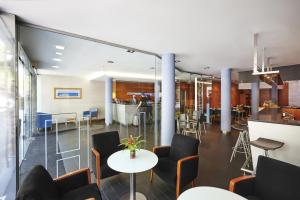 Reštaurácia alebo iné gastronomické zariadenie v ubytovaní Barcelona Century Hotel