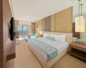 a hotel room with a bed and a television at The Resort in Mumbai