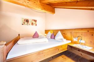 Rúm í herbergi á Mitterbruggehof Apt Berganemone
